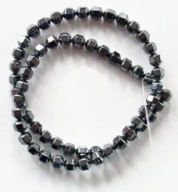 16 inch strand of 7mm Hematite Lantern Beads